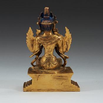 A Sino-Tibetan gilt bronze figure of Maitreya.