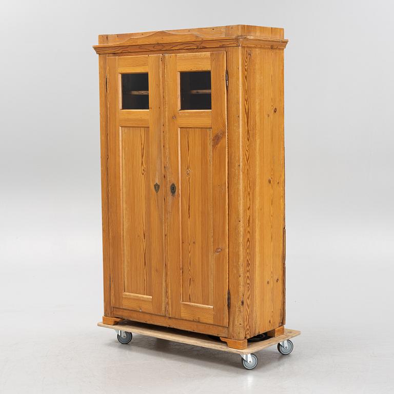 A pinewood cabinet, later part of the 19th Century.