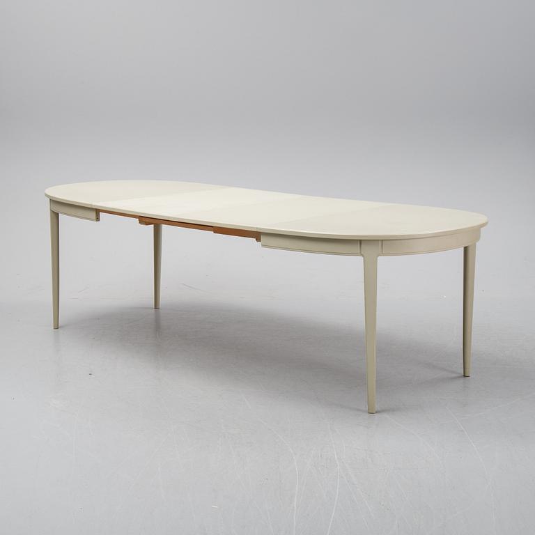 A dining table with two armchairs and six chairs by Carl Malmsten for Bodafors.