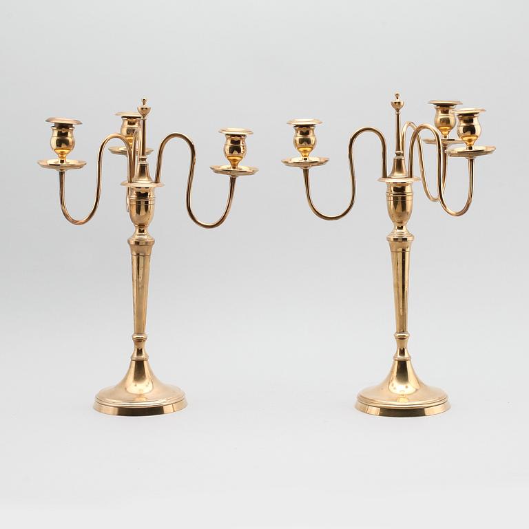 KANDELABRAR, 1 par, mässing, Nils Petter Linderberg, Sundsvall, omkring år 1900.
