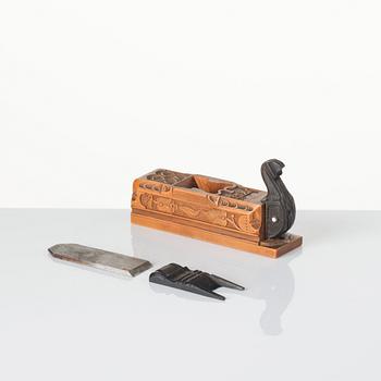 A Swedish carved ebony, boxwood and bone plane, dated 1748.