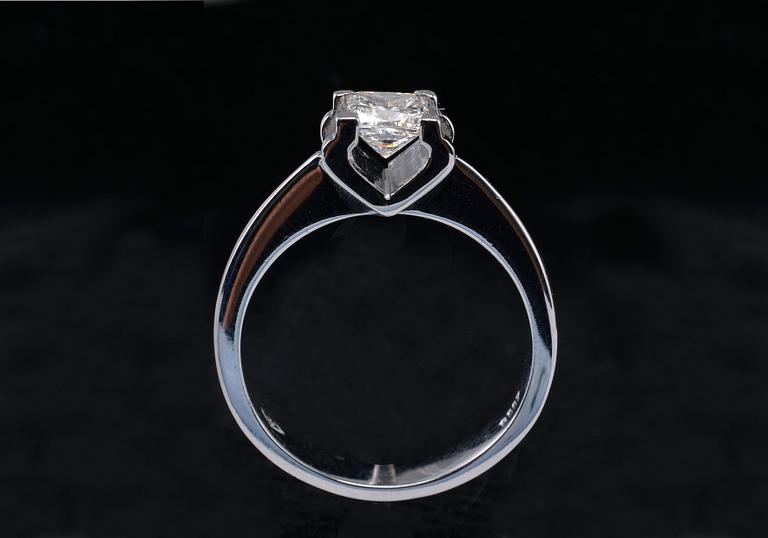 A RING, princess cut diamond 0.71 ct. H/vvs1 laserengraved ID no. GIA certifikat 18K white gold, weigth 5,1 g.
