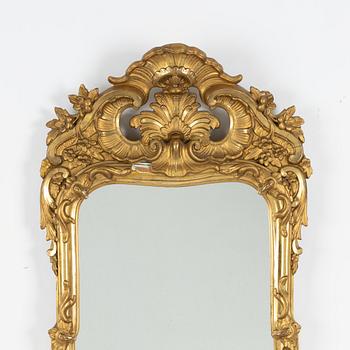 A Rococo style mirror, first half of the 20th Century.