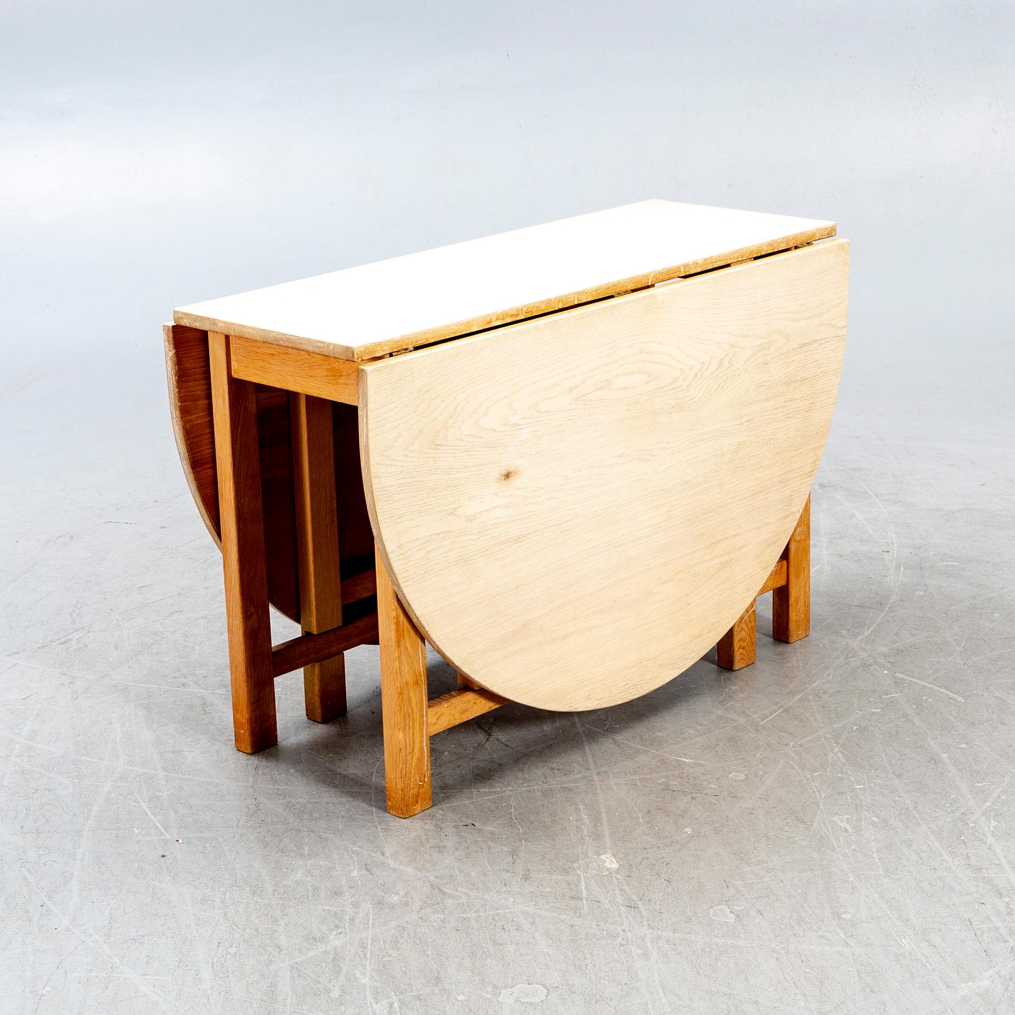 A 20th century oak folding table.