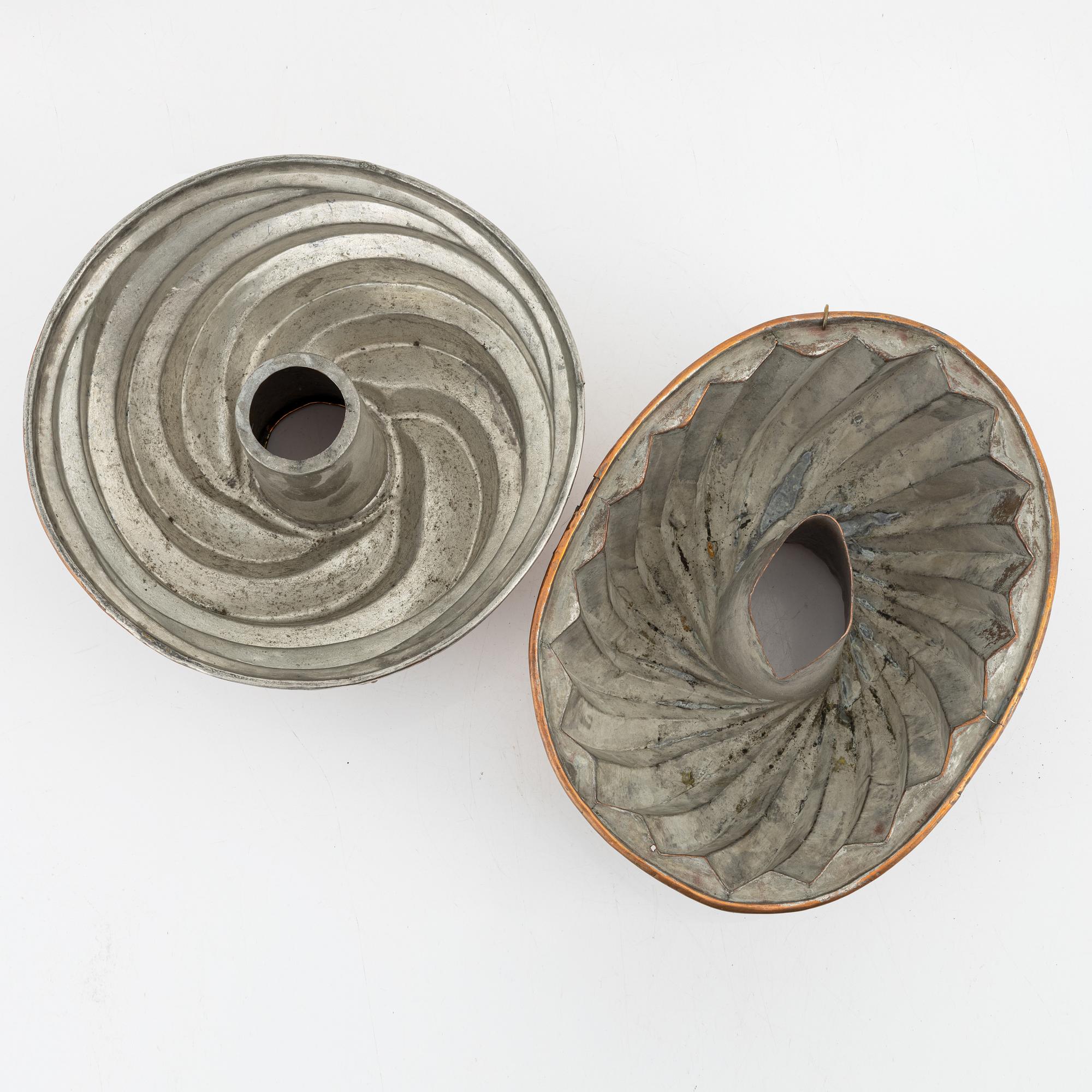 Four copper cake moulds. 18th and 19th Century.