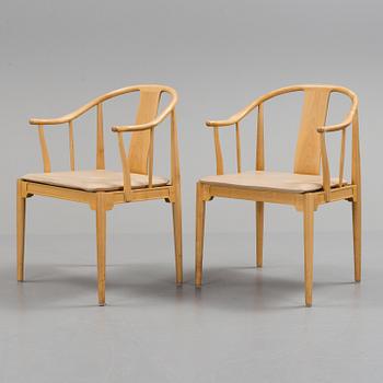 A pair of Hans J Wegner cherry 'China' chairs, Fritz Hansen, Denmark 1987.