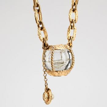 YVES SAINT LAURENT, a gold colored necklace with glas stones.