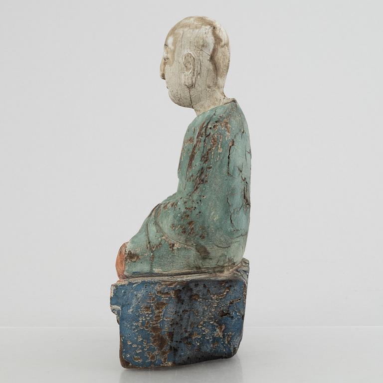A Louhan, carved and painted wood, China, late Qing dynasty.
