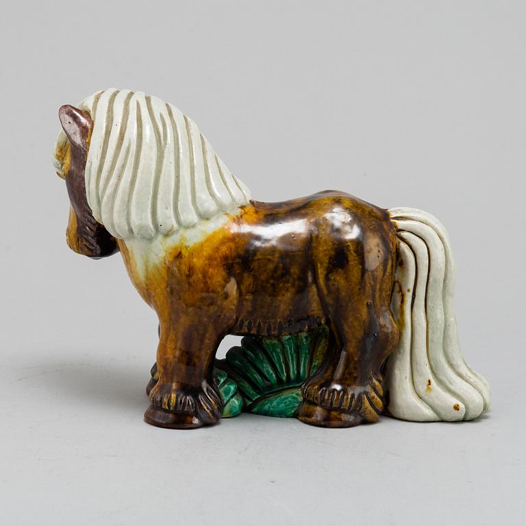 GUNNAR NYLUND, a chamotte stoneware figurine of a horse, from Rörstrand.