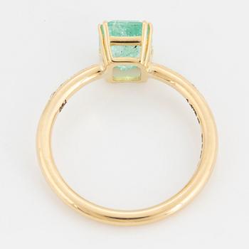 Emerald-cut  pale emerald and brilliant-cut diamond ring.