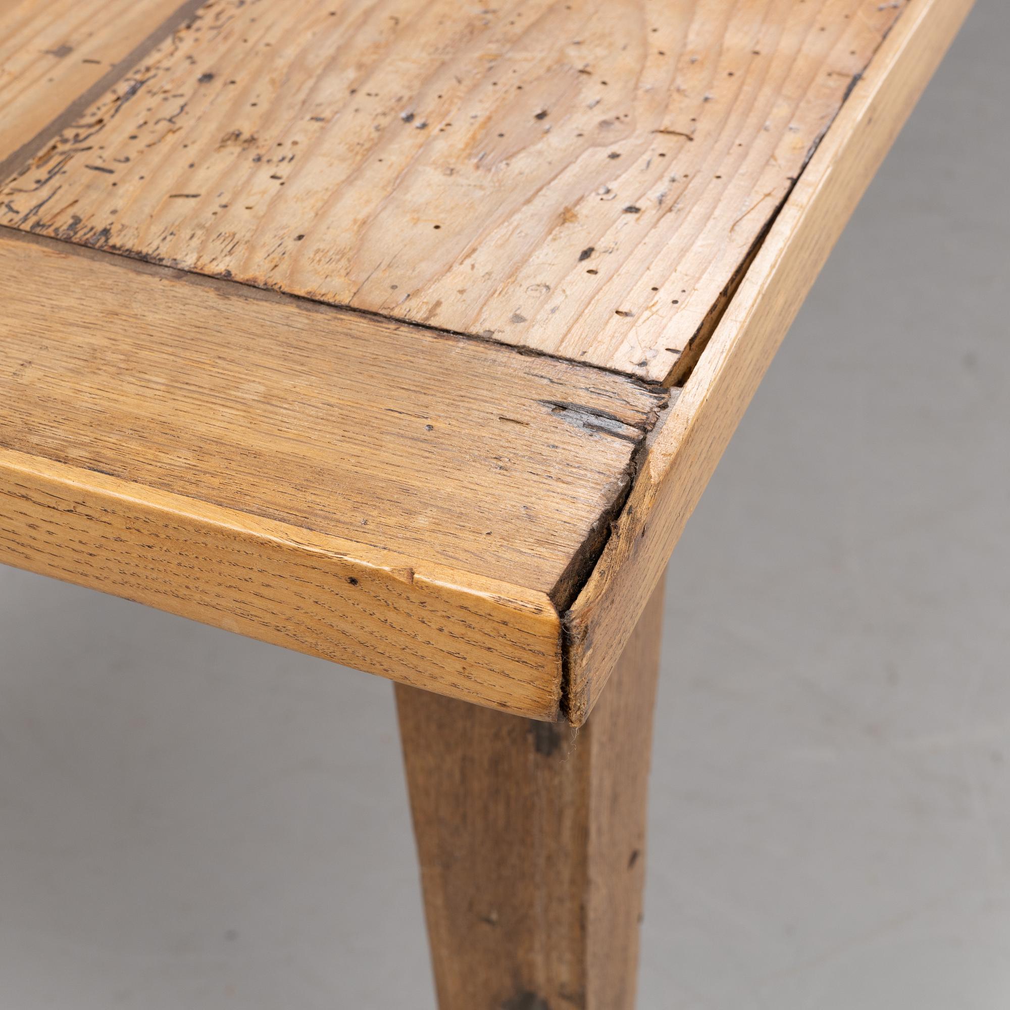 A contemporary French country style dining table.