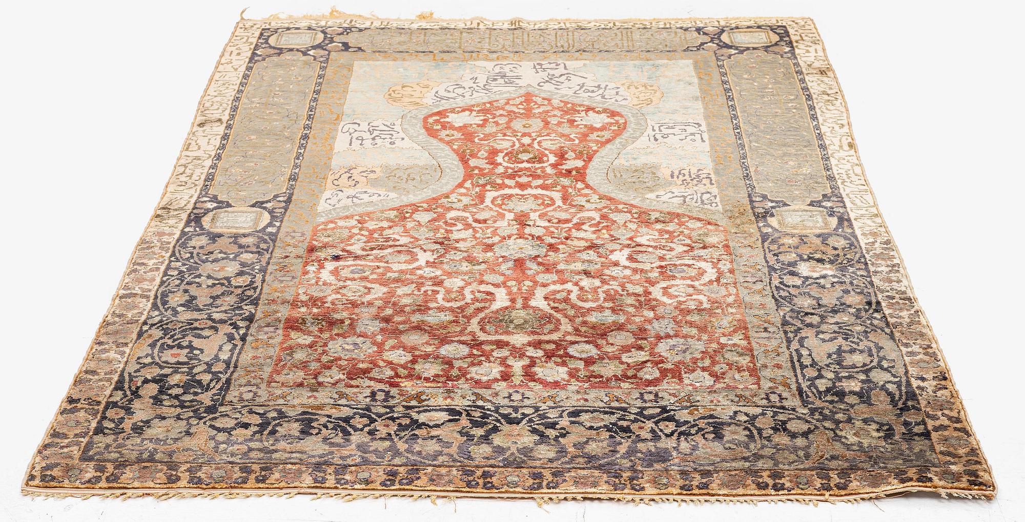 An antique silk rug, probably Istanbul, Turkey, c. 181 x 127 cm.