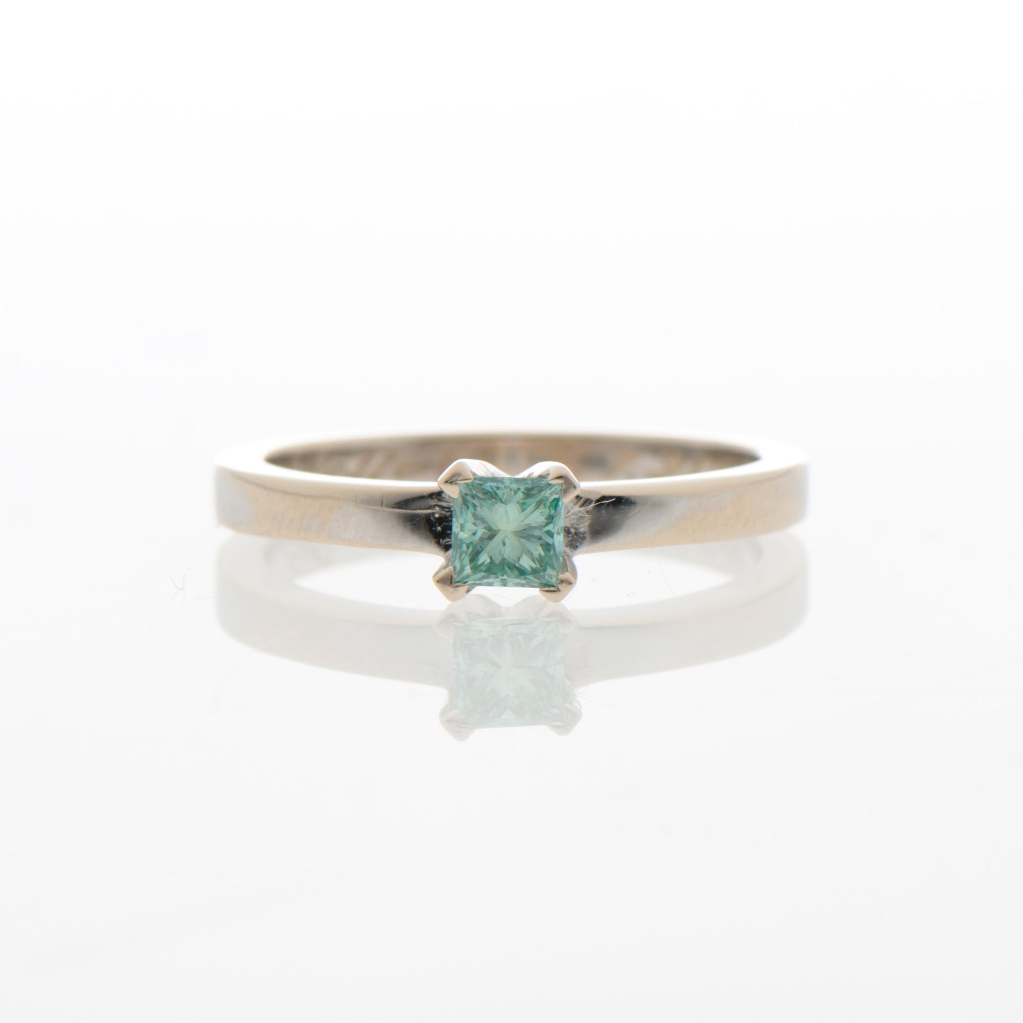 A RING, treated green diamond, 14K white gold.
