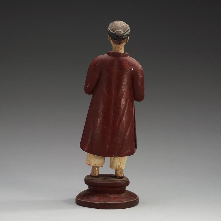 A painted wooden export figure of a China man, Qing dynasty, 18th Century.
