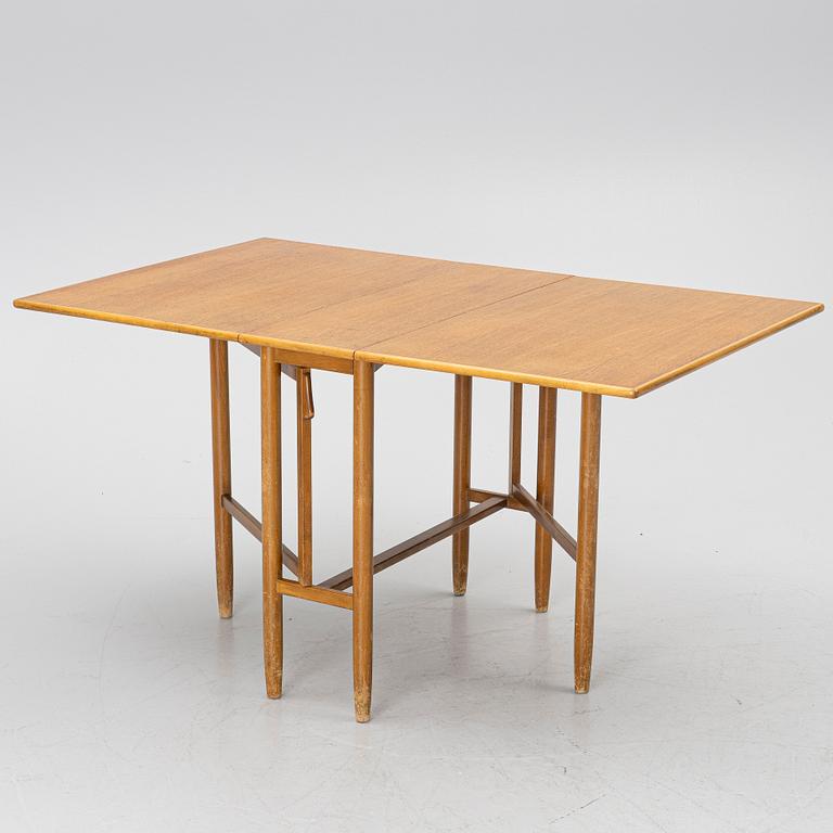 A mid20th century gate-leg table.