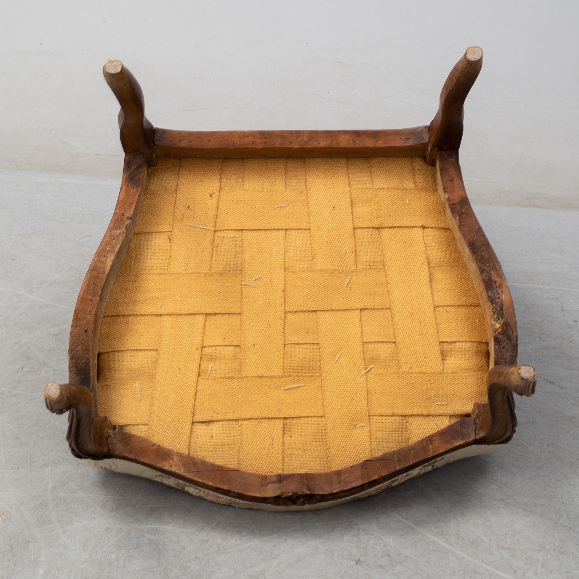 A mid 18th century Rococo arm chair.