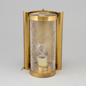 A WALL-LIGHT, brass and glass, probably 1970s.