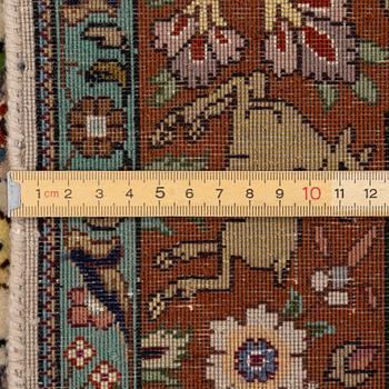 A Tabriz part silk rug, c. 145 x 100 cm.