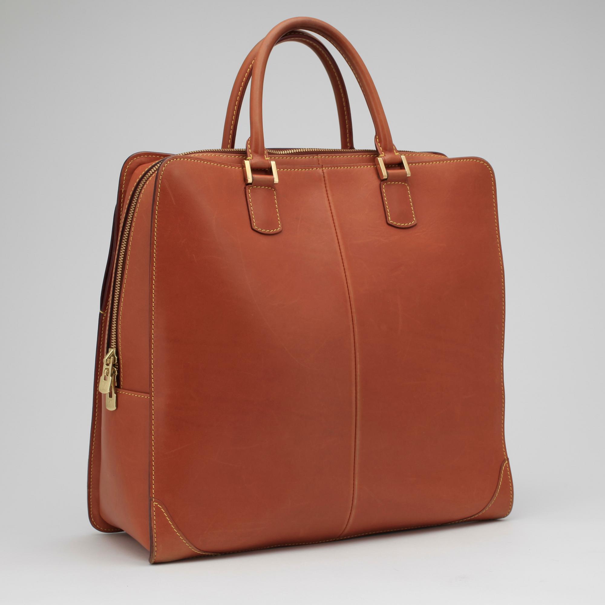 LOUIS VUITTON, a brown leather handbag.