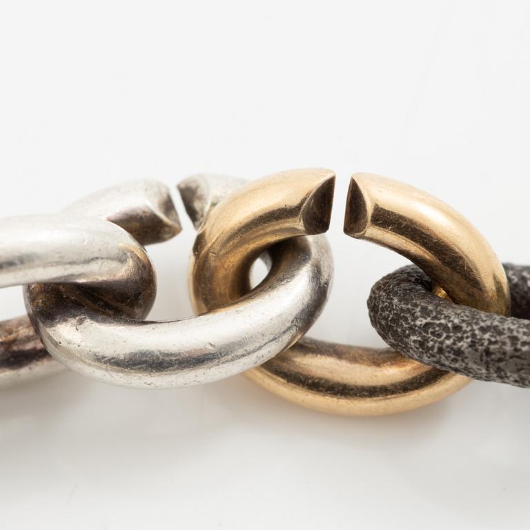 Mikael Hamma, a bracelet 18K gold, sterling silver and oxidised iron, Stockholm 1996.