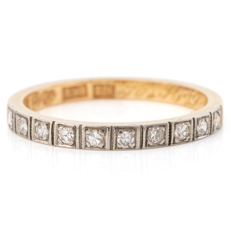18K gold half-eternity ring with octagonal-cut diamonds.