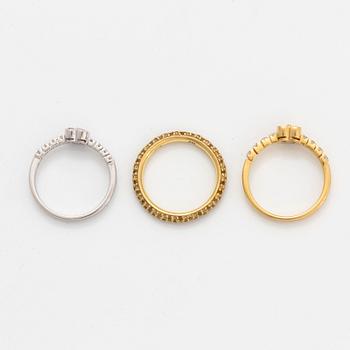 Yellow and pink sapphire and brilliant-cut diamond three rings.