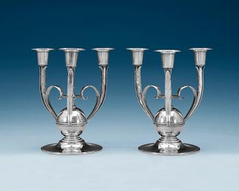 A pair of Atelier Borgila silver candelabra for three candles, Stockholm 1932.