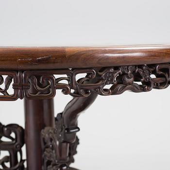 A Chinese wooden table, early 20th century.