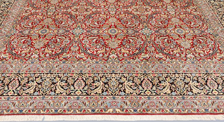 A Kirman Laver carpet, 'Millefleur', approx. 403 x 304 cm.