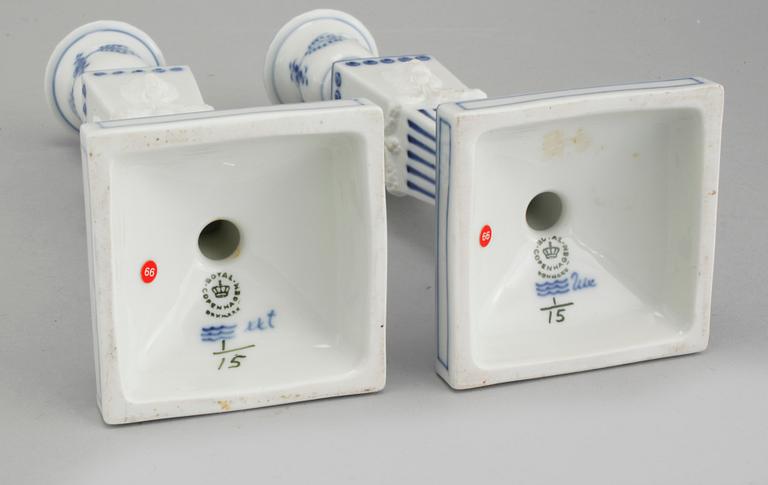 A pair of "Musselmalet" candel holders made by Royal Copenhagen, 20th century.