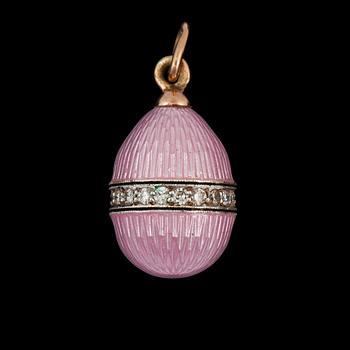 1075. A pink enamel pendant in the shape of an egg, surrounded by diamonds, circa 0.30 ct total carat weight.