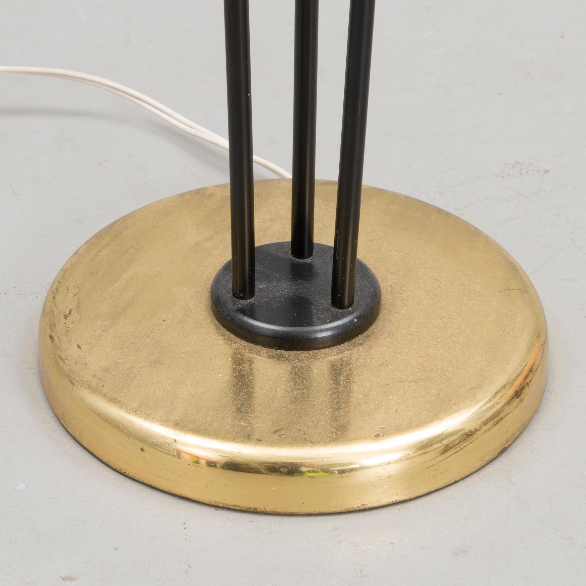 A mid 20th century floor lamp, marked AJH.7.