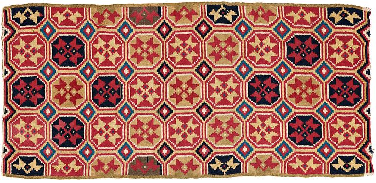 A CARRIAGE CUSHION, double-interlocked tapestry, "Stjärnmönster", ca 43,5-44,5 x 94-95 cm, Scania (Sweden).