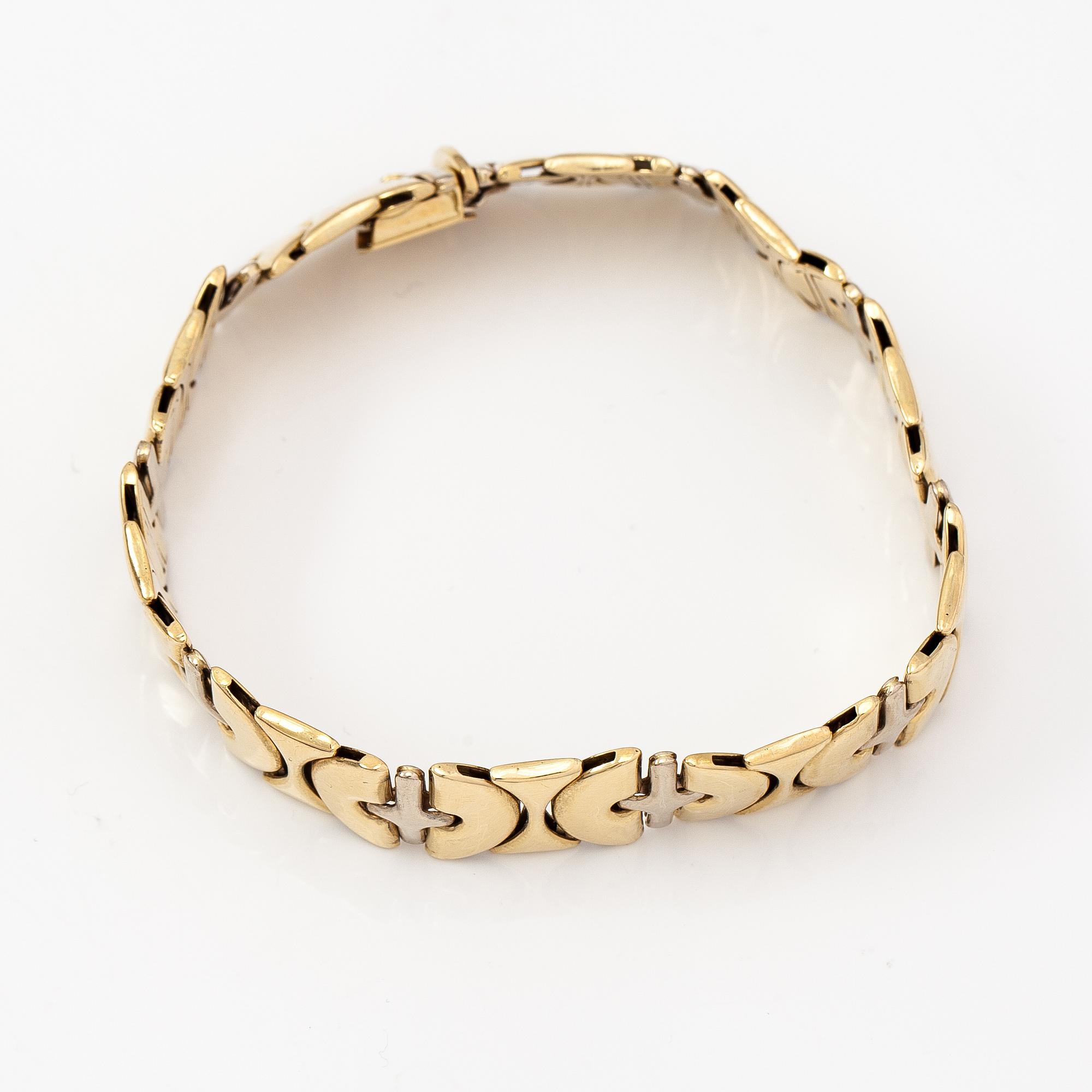 A 14K white and yellow gold bracelet.