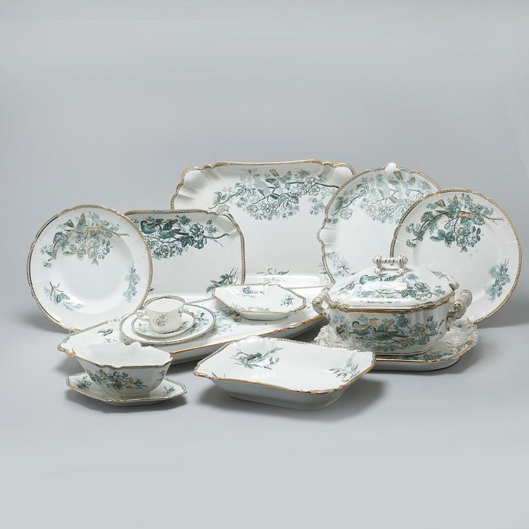 A earthenware table set of 136 pcs "Vexiö Guld",  by Arvid Ekberg, Gustafsberg, from around year 1900.
