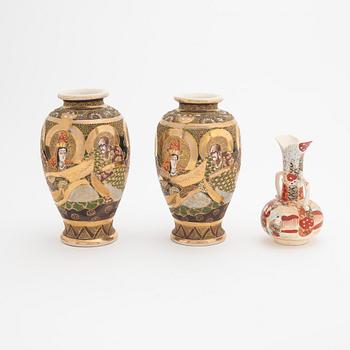 A pair of Japanese Satsuma vases and a vase with handles, 20th Century.