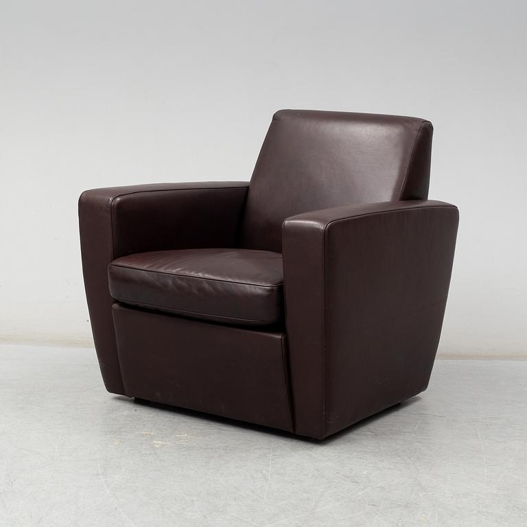 A contemporary brown leather easy chair from Moroso.