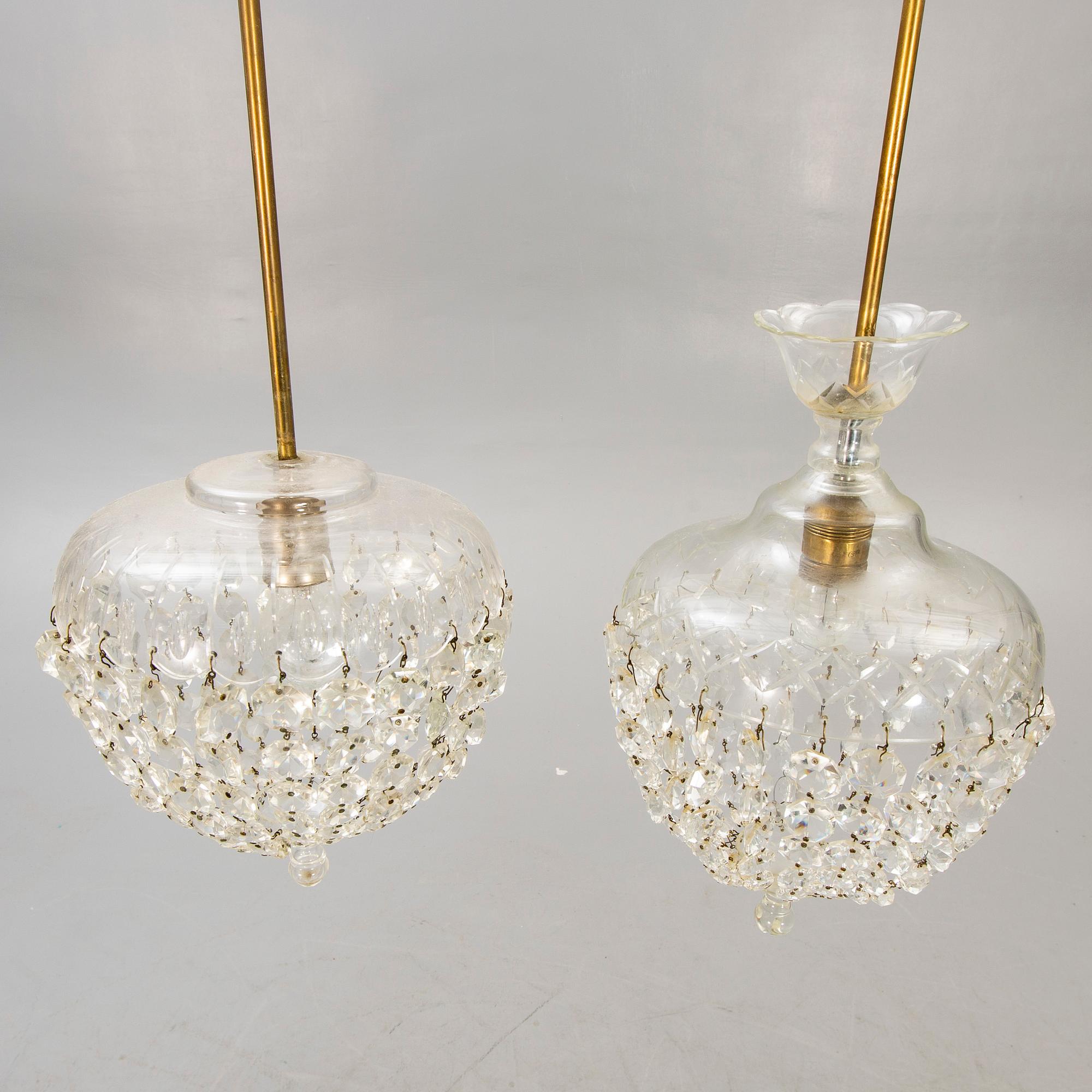 A pair of ceiling pendants around 1900.