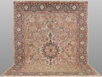 A 'Millefleur' Kerman Laver carpet, c. 398 x 300 cm.