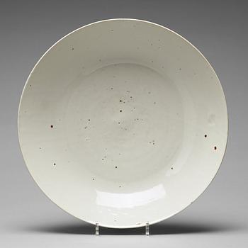 A large white glazed Swatow dish, Ming dynasty (1368-1644).