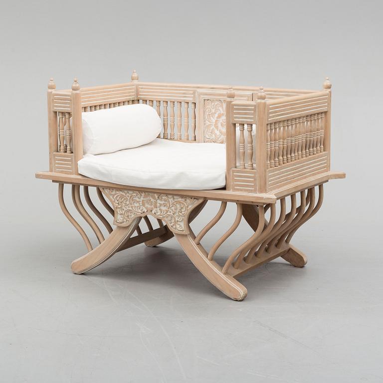 an elephant chair from the late 20th century.