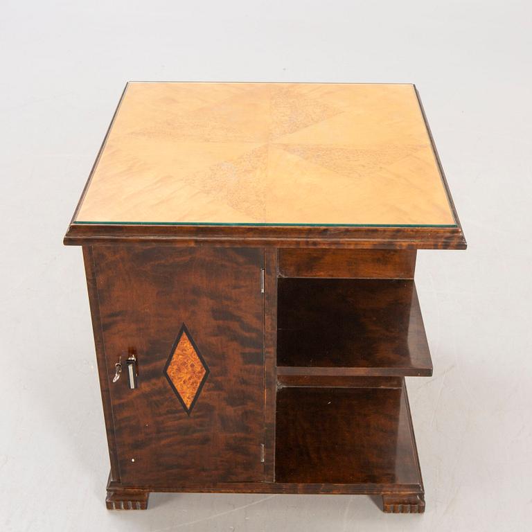 A 1930s birch side table.