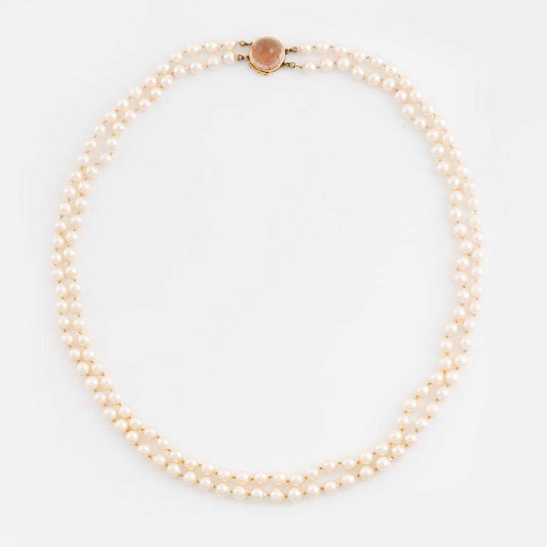 Two strand cultured pearl necklace, 18K gold clasp with rutile quartz.