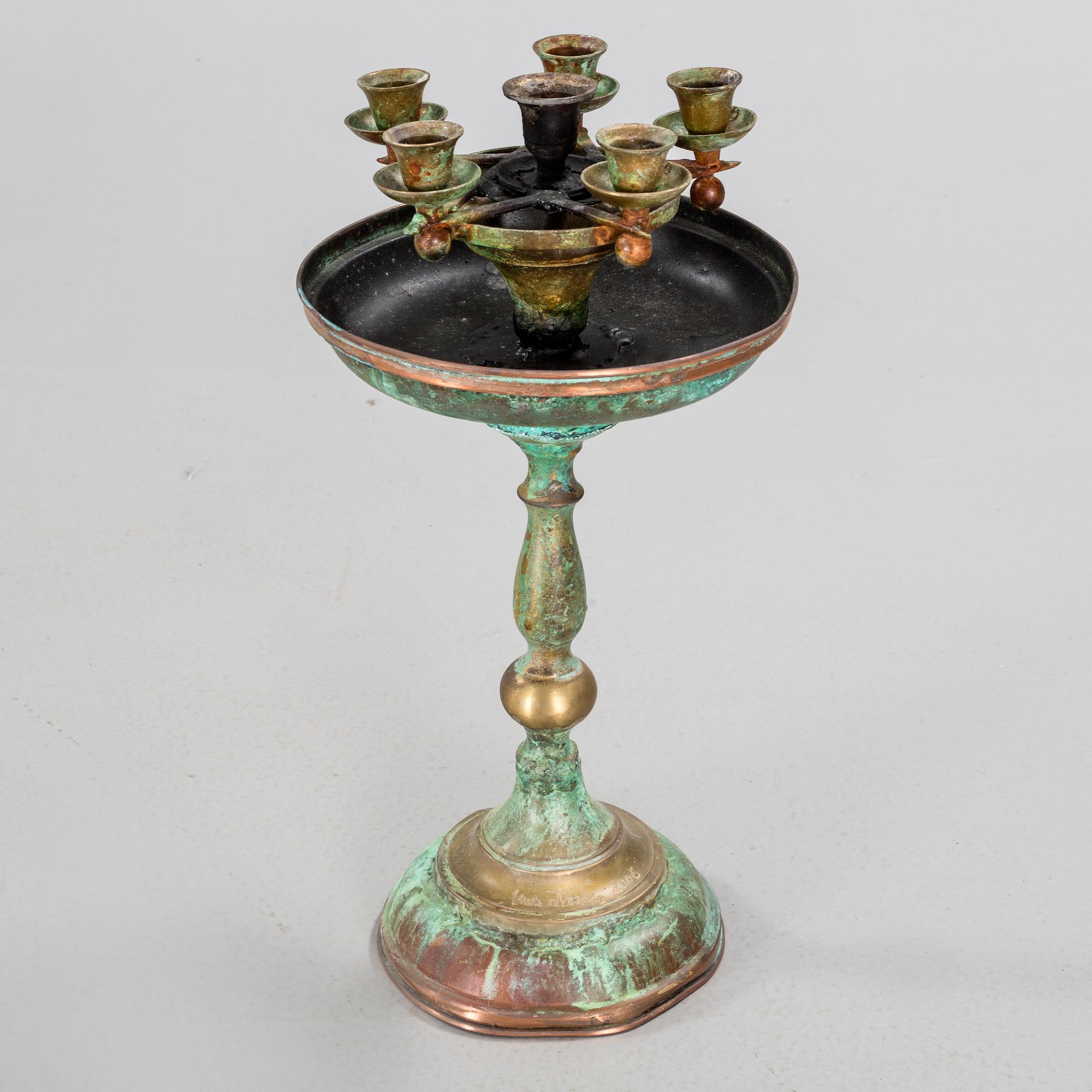 a metal sculpture group in eight parts, partly signed.