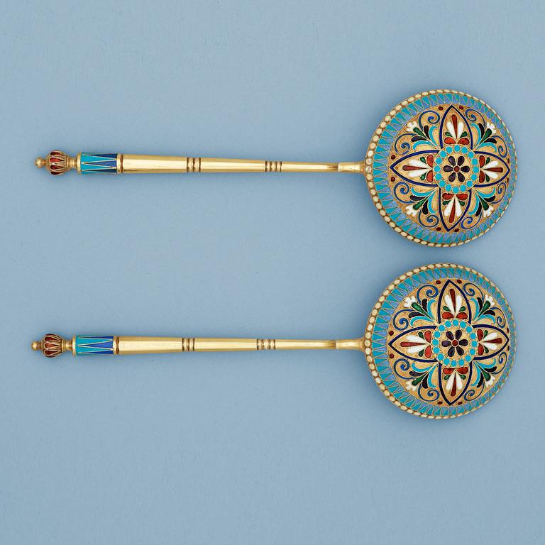 A pair of Russian 20th century silver-gilt and enamel kaviar spoons, makers mark of A. Lubavin, St. Petersburg 1908-17.