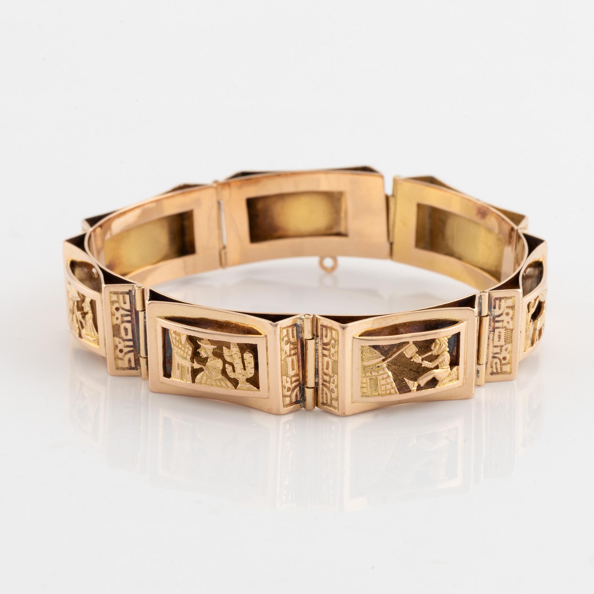 Gold panel bracelet.