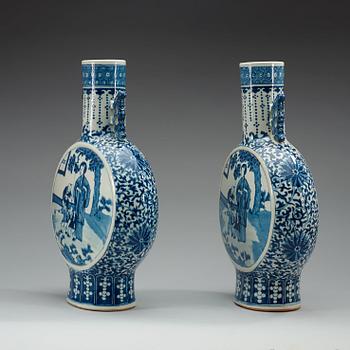 A pair of large blue and white moon flasks, late Qing dynasty (1644-1912), with Kangxi four character mark.