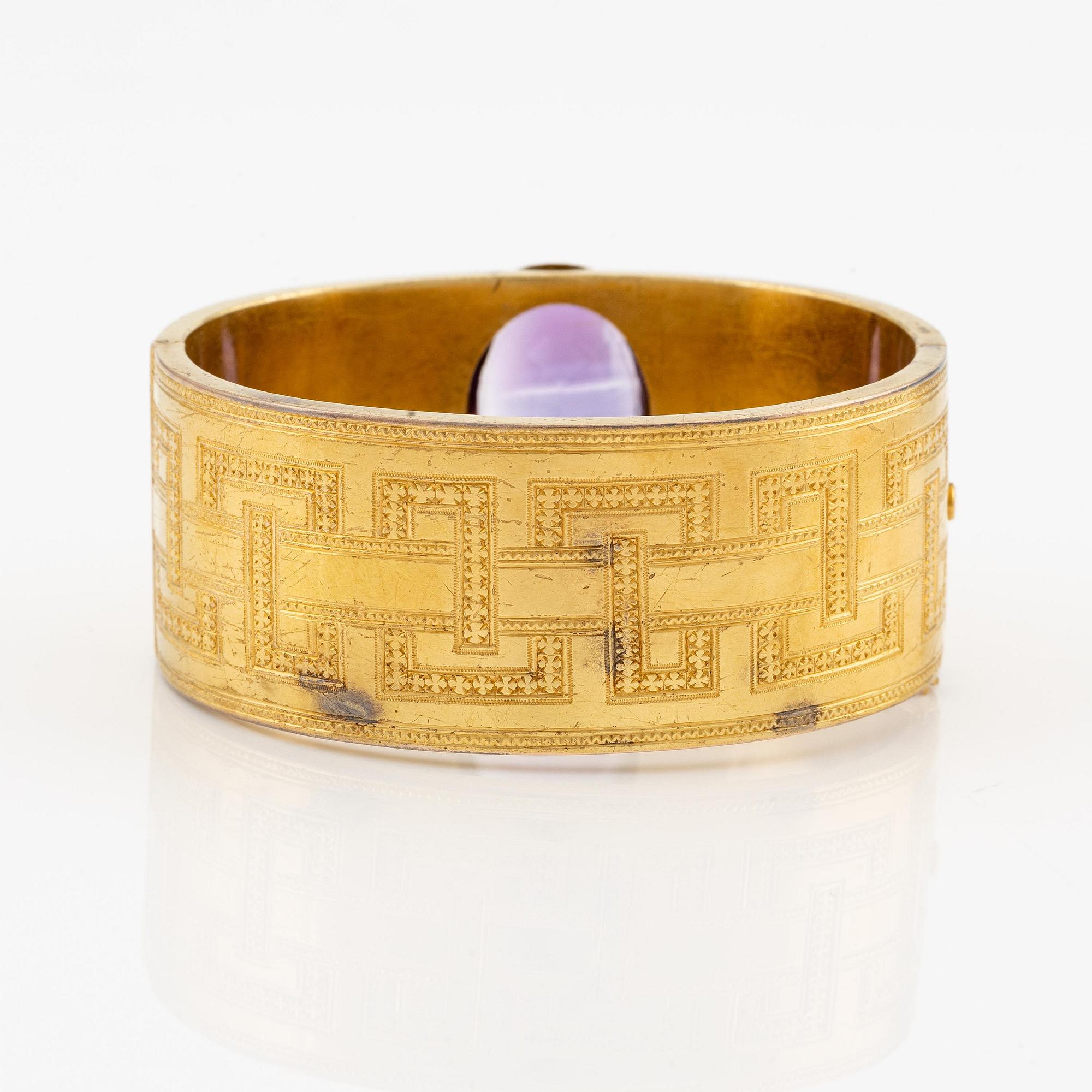 Armband 14K guld med en fasettslipad ametist.