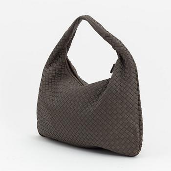 Bottega Veneta, a grey intrecciato leather bag.
