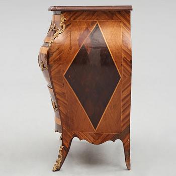 A Swedish rosewood-veneered Rococo chest of drawers, later part of the 18th century.